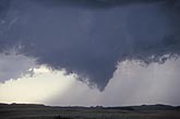 A weakly rotating wall cloud resembling a funnel cloud