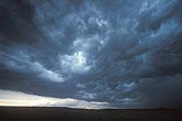 Shelf cloud filled with Stratocumulus and embedded Cumulus clouds