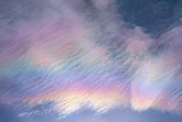Fine billows comb clouds with several colored bands of iridescence