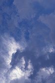 Sky texture abstract of drifting, dreamy cloud tufts 