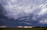 Heavy, dark, turbulent clouds bring stormy weather