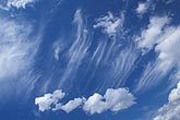 Visual attraction of opposites: streaky Cirrus and puffy Cumulus clouds