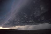 The sharply sculpted edge of a storm gust front (Arcus cloud)