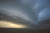 An eerie light and smoothly sculpted Arcus cloud