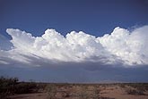 A line of clouds boils into a storm cloud 