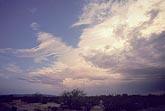 A threatening storm cloud in the desert twilight