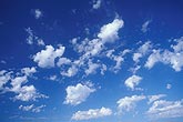 Puffs of Altocumulus cloud are creating a stir in a deep blue sky