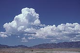 Boiling Cumulus Congestus clouds grow over mountains