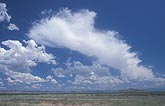 An anvil cloud hints at the history of distant updraft towers