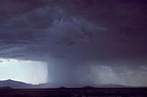 A cloudburst with rain curtain, lighter rain on right, heavier on left