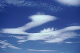 Smoothly sculpted wave clouds add magic and whimsy to the sky