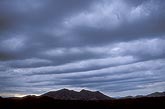 Long billows of brooding clouds due to a passing wave train