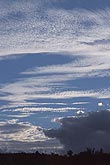Rhythmic streaks of cloud adorn a meditative sky 