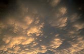 Abstract of glowing Mammatus clouds in a stormy sky
