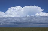 Cumulonimbus cloud cells evolving out of an elevated unstable layer