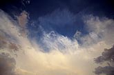 Abstract sky of frayed and tufted cloud edges