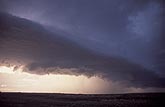 The dark Arcus cloud on the gust front of a powerful storm