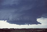 Close view of a circular wall cloud with typical tail