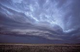 A multi-layered shelf cloud (Arcus) with a loose wave-like pattern