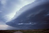 A foreboding low storm with an arched Arcus on the leading edge 