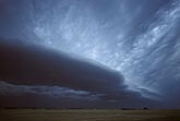 A dark laminar storm Arcus sweeps across a lonely landscape