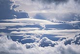 Ethereal layers of clouds create a heavenly scene above the clouds