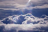 Heavenly rays bathe a sea of soft clouds in inspiration