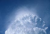 Close view of misty Pileus cloud on the crown of a storm