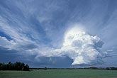 A small, beautiful storm cloud with a glowing white crown