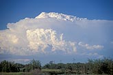Distant supercell storm cloud structure: penetrating top, flared anvil