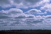 When does Cumulus become Stratocumulus: layering and bubbling