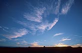 A flight of angelic cloud wisps in subtle twilight