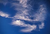 Joyous bursts of cloud detail in a deep blue sky abstract