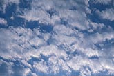 Abstract: erratic pattern of clouds with a clotted texture 