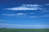 Pristine cloudscape: open land, white clouds and pure blue sky 