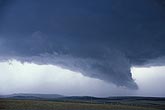 Close view of the lowered base under a compact supercell storm