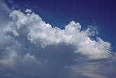 A ragged, woolly cloud mass sprawls across the sky
