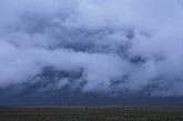 A low, drifting layer of scud (Pannus) below a Nimbostratus overcast