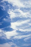 Streaks of wispy cloud fill the sky with rhythmic movement