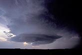 A lowered disk of rotating cloud in a dark and stormy sky
