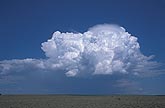 Energetic Cumulonimbus cloud with Pileus cap at its top