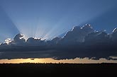 A bright fan of crepuscular rays create an inspirational sunset 