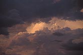 Moody light and shadow on soft clouds in a dusky glow