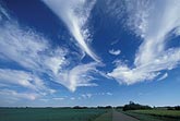 Spectacular pure white Cirrus cloud plumes in triangular patches
