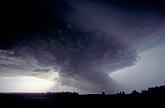 A supercell lowering tightening into a wall cloud