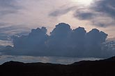 A band of boiling Cumulus clouds silhouetted at dusk
