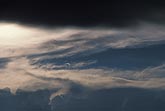 A brooding mix of glowing and shaded clouds