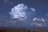 Boiling domes of towering Cumulus clouds grow vigorously