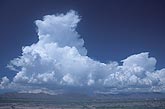 Mountain thunderstorm clouds: Cumulonimbus with frozen anvils