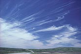 The slender filaments of mares’ tails streak away from Cirrus clouds